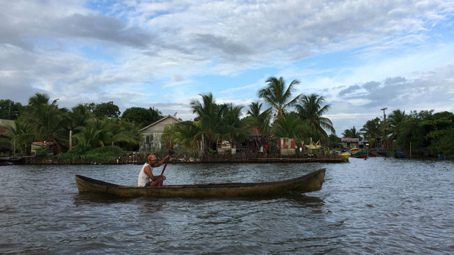 Mosquito Coast Nicaragua man in dugout canoe