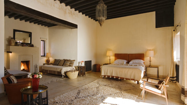 Kasbah Bab Ourika bedroom with fireplace