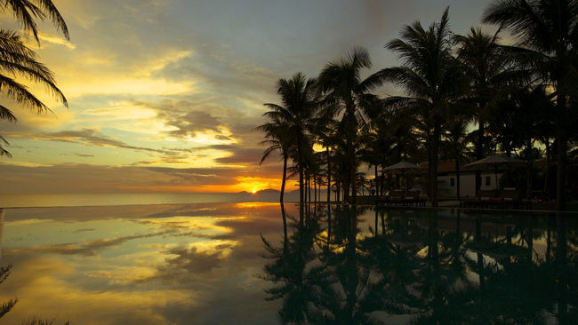 The Nam Hai infinity pool at sunset