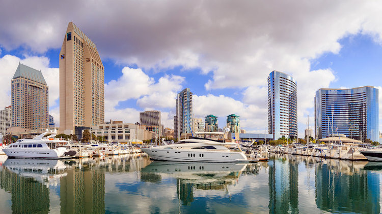 How does chartering a private yacht compare with vacationing at a luxury hotel?