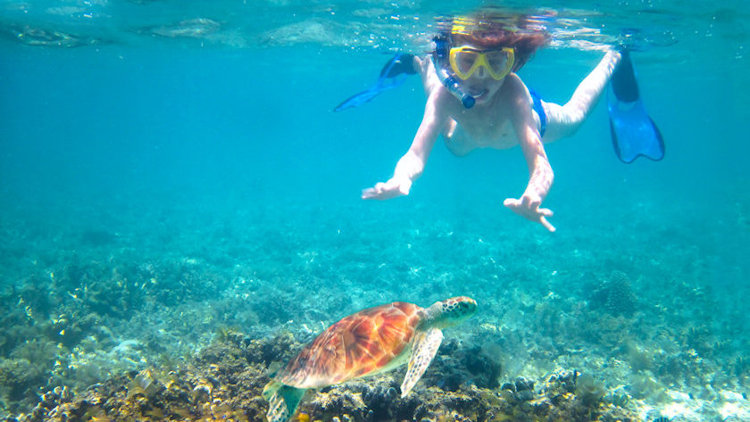 child snorkeling