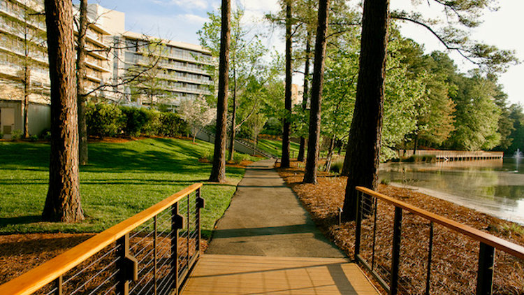 The Umstead Hotel features its own lake with surrounding walking path