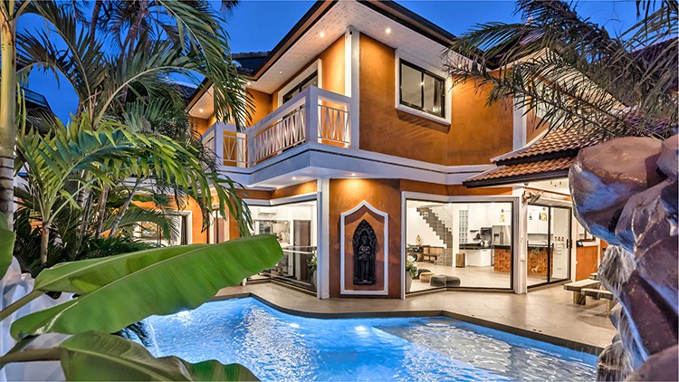 TUCHELAND at dusk, a 7-bedroom Golden Thai Bali pool villa in Pattaya